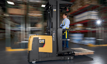 Brochure image of a worker driving Cat High-Level Order Picker in warehouse